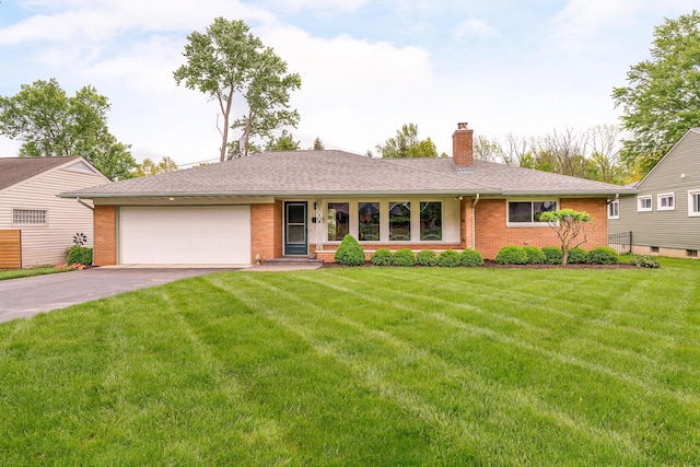 316 Charleston Ave, Columbus, OH 43214 - single story home featuring brick siding, driveway, an attached garage, and a chimney