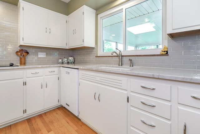316 Charleston Ave, Columbus, OH 43214 - kitchen featuring dishwasher, a sink, light countertops, and decorative backsplash