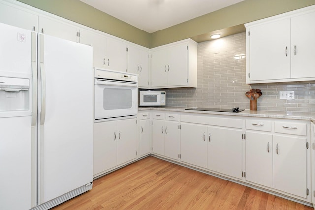 316 Charleston Ave, Columbus, OH 43214 - kitchen with white appliances, decorative backsplash, light countertops, and light wood finished floors