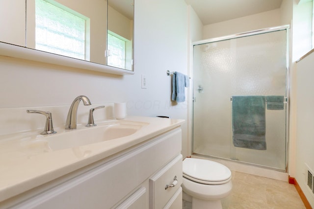 316 Charleston Ave, Columbus, OH 43214 - bathroom with a shower stall, toilet, and vanity