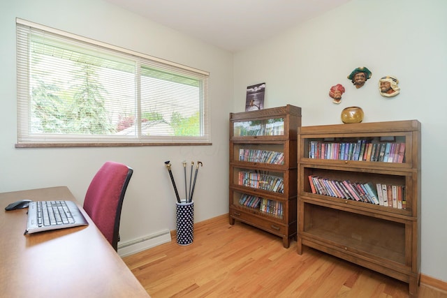 316 Charleston Ave, Columbus, OH 43214 - office area featuring a baseboard heating unit, light wood-type flooring, and baseboards