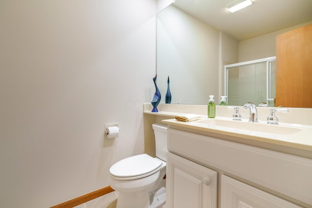 316 Charleston Ave, Columbus, OH 43214 - full bathroom featuring toilet, a stall shower, vanity, baseboards, and tile patterned floors