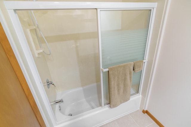 316 Charleston Ave, Columbus, OH 43214 - bathroom featuring enclosed tub / shower combo and tile patterned flooring