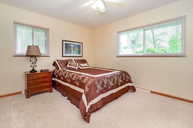 316 Charleston Ave, Columbus, OH 43214 - bedroom with carpet floors, a baseboard heating unit, baseboards, and a ceiling fan