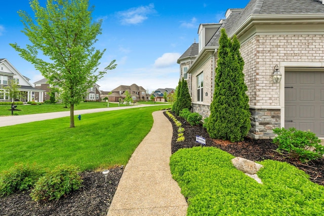 6540 Marshview Dr, Hilliard, OH 43026 - view of green lawn with a residential view and a garage