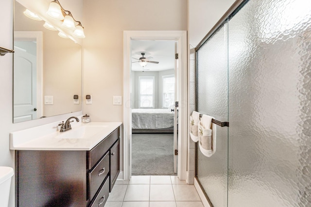 6540 Marshview Dr, Hilliard, OH 43026 - bathroom featuring tile patterned flooring, a shower stall, ceiling fan, and ensuite bathroom