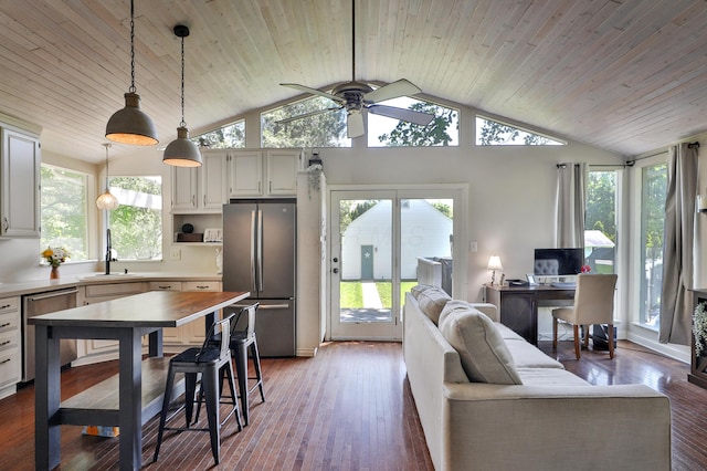 living area with a ceiling fan, vaulted ceiling, hardwood / wood-style flooring, and wooden ceiling