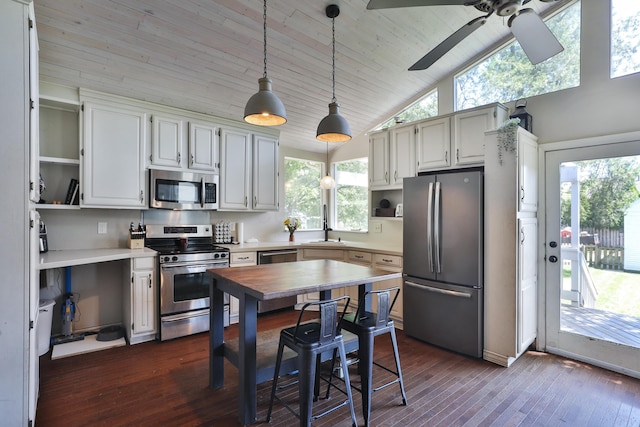 kitchen with stainless steel appliances, open shelves, plenty of natural light, ceiling fan, and high vaulted ceiling