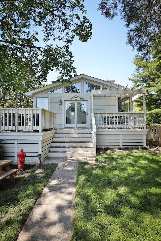 view of front of property with a pergola and a deck