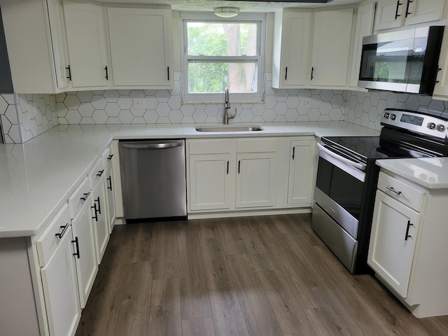 1989 Torchwood Dr, Columbus, OH 43229 - kitchen with appliances with stainless steel finishes, a sink, and white cabinetry