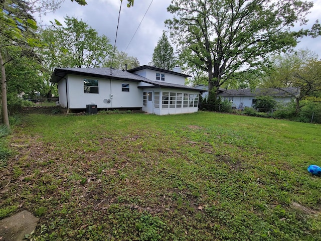 1989 Torchwood Dr, Columbus, OH 43229 - rear view of property with a sunroom and central AC