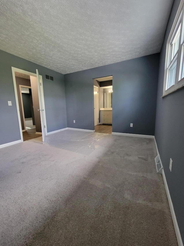 1989 Torchwood Dr, Columbus, OH 43229 - unfurnished room with baseboards, carpet flooring, and a textured ceiling
