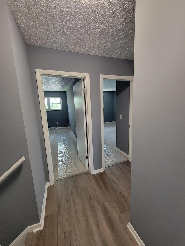 1989 Torchwood Dr, Columbus, OH 43229 - hallway with wood finished floors and baseboards