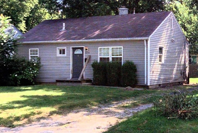 3250 Karl Rd, Columbus, OH 43224 - view of front of property with a front lawn and a chimney
