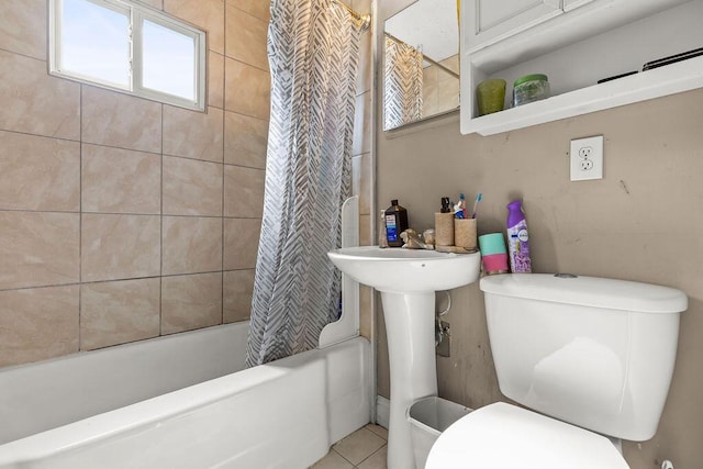 3250 Karl Rd, Columbus, OH 43224 - bathroom featuring healthy amount of natural light, shower / bath combination with curtain, and tile patterned floors