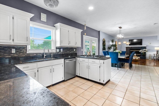 10164 Busey Rd, Canal Winchester, OH 43110 - kitchen featuring appliances with stainless steel finishes, open floor plan, decorative backsplash, white cabinets, and a peninsula
