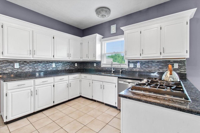 10164 Busey Rd, Canal Winchester, OH 43110 - kitchen with appliances with stainless steel finishes, white cabinets, and tasteful backsplash