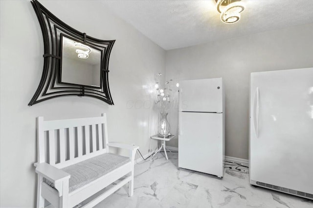 10164 Busey Rd, Canal Winchester, OH 43110 - bedroom featuring freestanding refrigerator, marble look tiles, and a textured ceiling