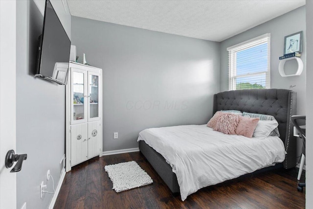 10164 Busey Rd, Canal Winchester, OH 43110 - bedroom with wood finished floors and a textured ceiling