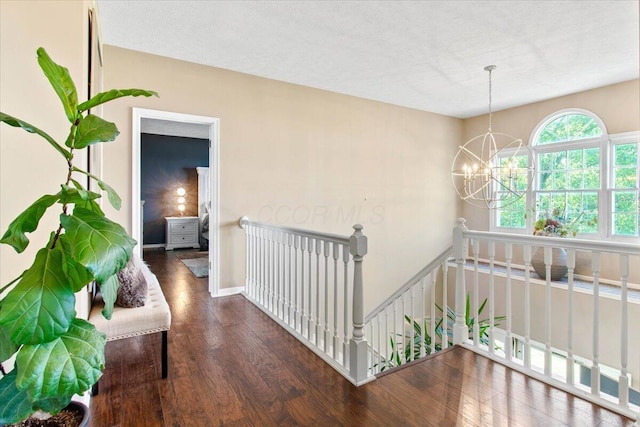 10164 Busey Rd, Canal Winchester, OH 43110 - hall with an upstairs landing, wood finished floors, and a chandelier