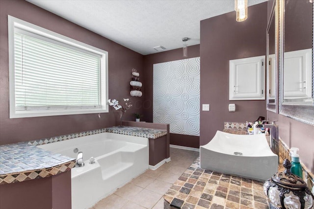 10164 Busey Rd, Canal Winchester, OH 43110 - full bathroom featuring a bath, tile patterned floors, a textured ceiling, and vanity