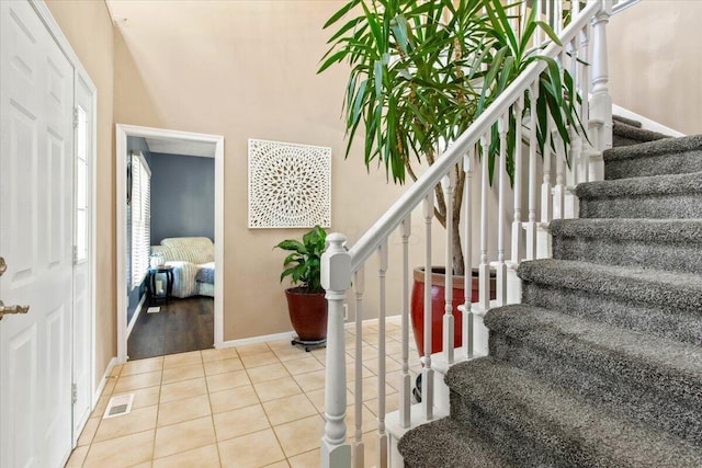 10164 Busey Rd, Canal Winchester, OH 43110 - staircase featuring tile patterned flooring and baseboards