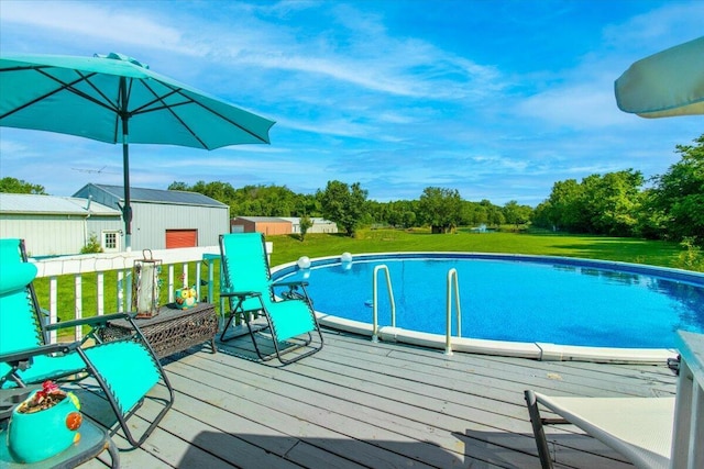 10164 Busey Rd, Canal Winchester, OH 43110 - outdoor pool with a deck, a lawn, and an outbuilding