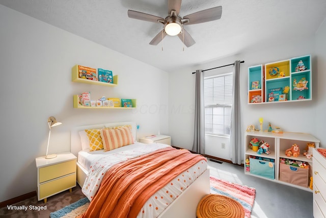 bedroom with carpet flooring, baseboards, and ceiling fan
