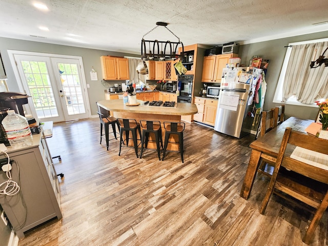 8696 Main St, Rushville, OH 43150 - dining space with wood finished floors and french doors