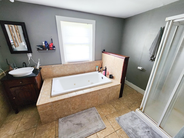 8696 Main St, Rushville, OH 43150 - full bath with tile patterned floors, a stall shower, a whirlpool tub, vanity, and baseboards