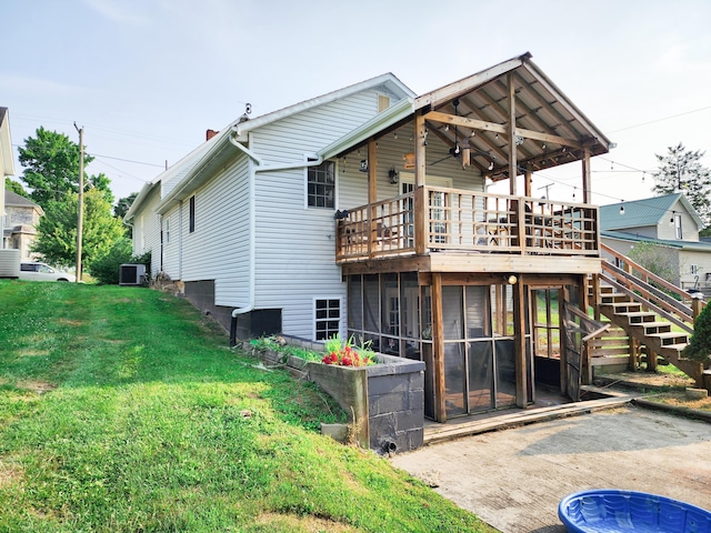 8696 Main St, Rushville, OH 43150 - back of property featuring a lawn, a wooden deck, cooling unit, stairway, and a chimney
