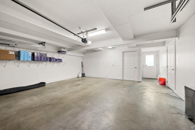 103 Lundy St, Columbus, OH 43215 - garage with a garage door opener and baseboards