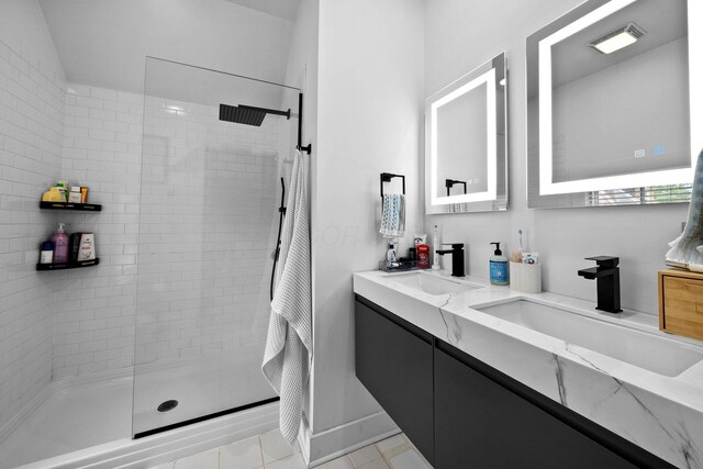 103 Lundy St, Columbus, OH 43215 - bathroom with double vanity, a tile shower, and tile patterned floors