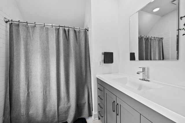 103 Lundy St, Columbus, OH 43215 - full bathroom with vanity, vaulted ceiling, recessed lighting, and a shower with curtain