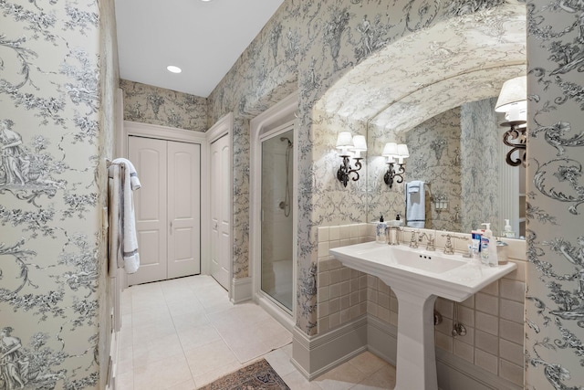 bathroom featuring tile patterned floors, a stall shower, and wallpapered walls