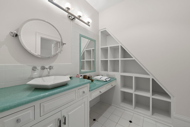 bathroom featuring tile patterned flooring and vanity