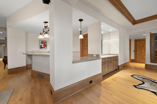 bar area with light wood finished floors, recessed lighting, baseboards, and decorative light fixtures