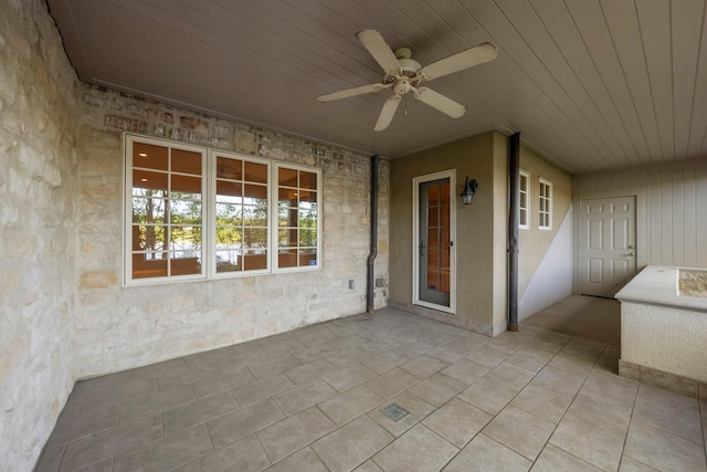view of patio featuring a ceiling fan