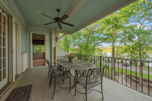 balcony featuring a ceiling fan and outdoor dining space