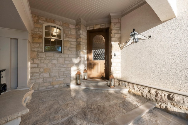 entrance to property featuring stone siding