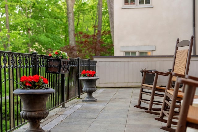 view of patio featuring fence