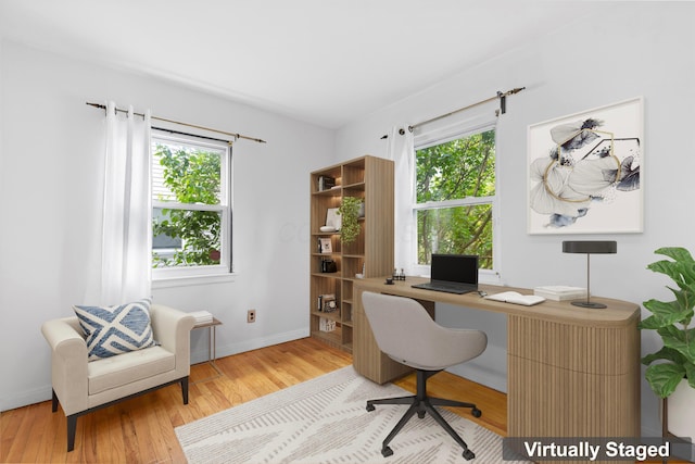3204 Mcguffey Rd, Columbus, OH 43224 - home office with wood finished floors and baseboards