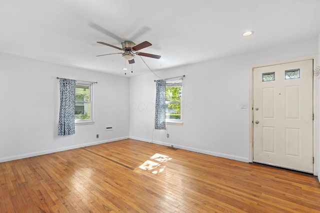 3204 Mcguffey Rd, Columbus, OH 43224 - entryway featuring a ceiling fan, healthy amount of natural light, light wood finished floors, baseboards, and recessed lighting