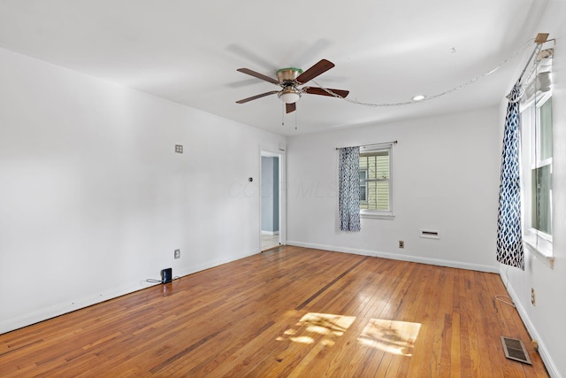 3204 Mcguffey Rd, Columbus, OH 43224 - empty room featuring a ceiling fan, wood-type flooring, and baseboards