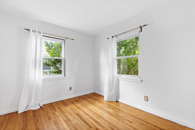 3204 Mcguffey Rd, Columbus, OH 43224 - spare room with baseboards and light wood-type flooring