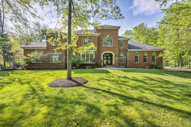3720 Hyatts Rd, Powell, OH 43065 - colonial house featuring brick siding, a front lawn, and french doors