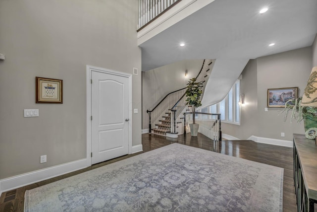3720 Hyatts Rd, Powell, OH 43065 - foyer entrance featuring baseboards, wood finished floors, stairway, a towering ceiling, and recessed lighting