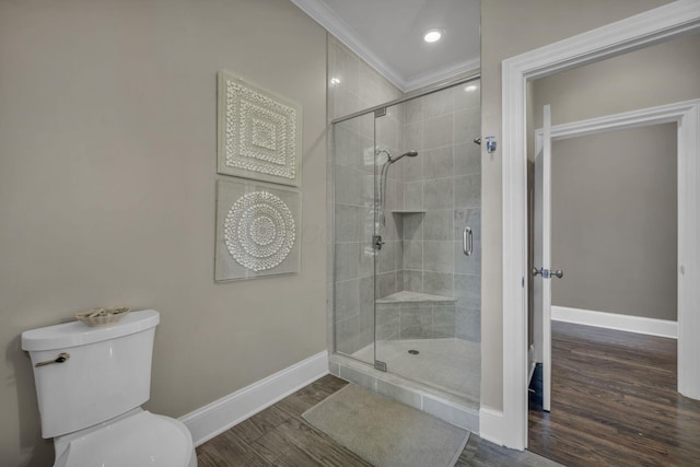 3720 Hyatts Rd, Powell, OH 43065 - full bath with baseboards, a stall shower, wood finished floors, toilet, and crown molding