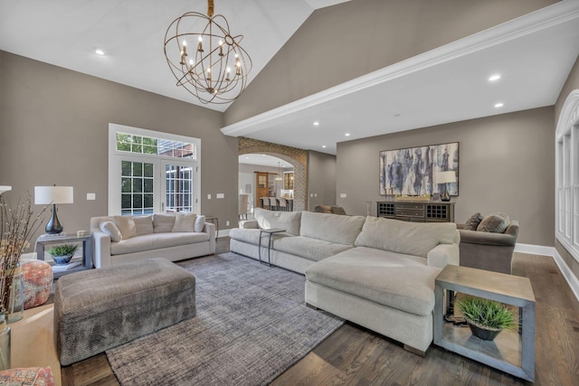 3720 Hyatts Rd, Powell, OH 43065 - living room featuring arched walkways, a chandelier, dark wood-style flooring, high vaulted ceiling, and baseboards
