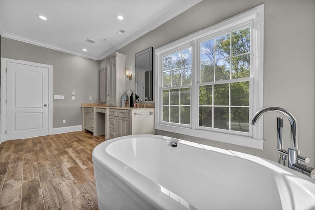 3720 Hyatts Rd, Powell, OH 43065 - full bathroom with vanity, ornamental molding, a freestanding bath, recessed lighting, and baseboards